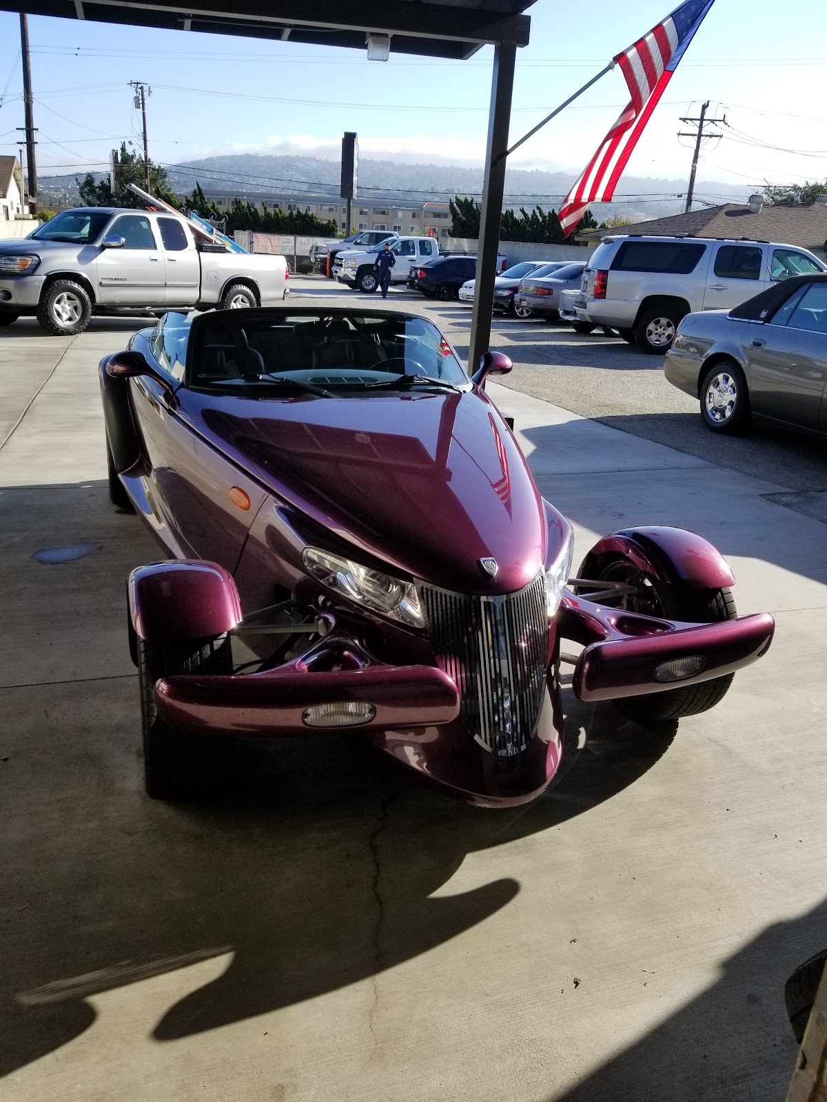 A purple Polaris Slingshot three wheeler on the lot at Nery's Auto Repair