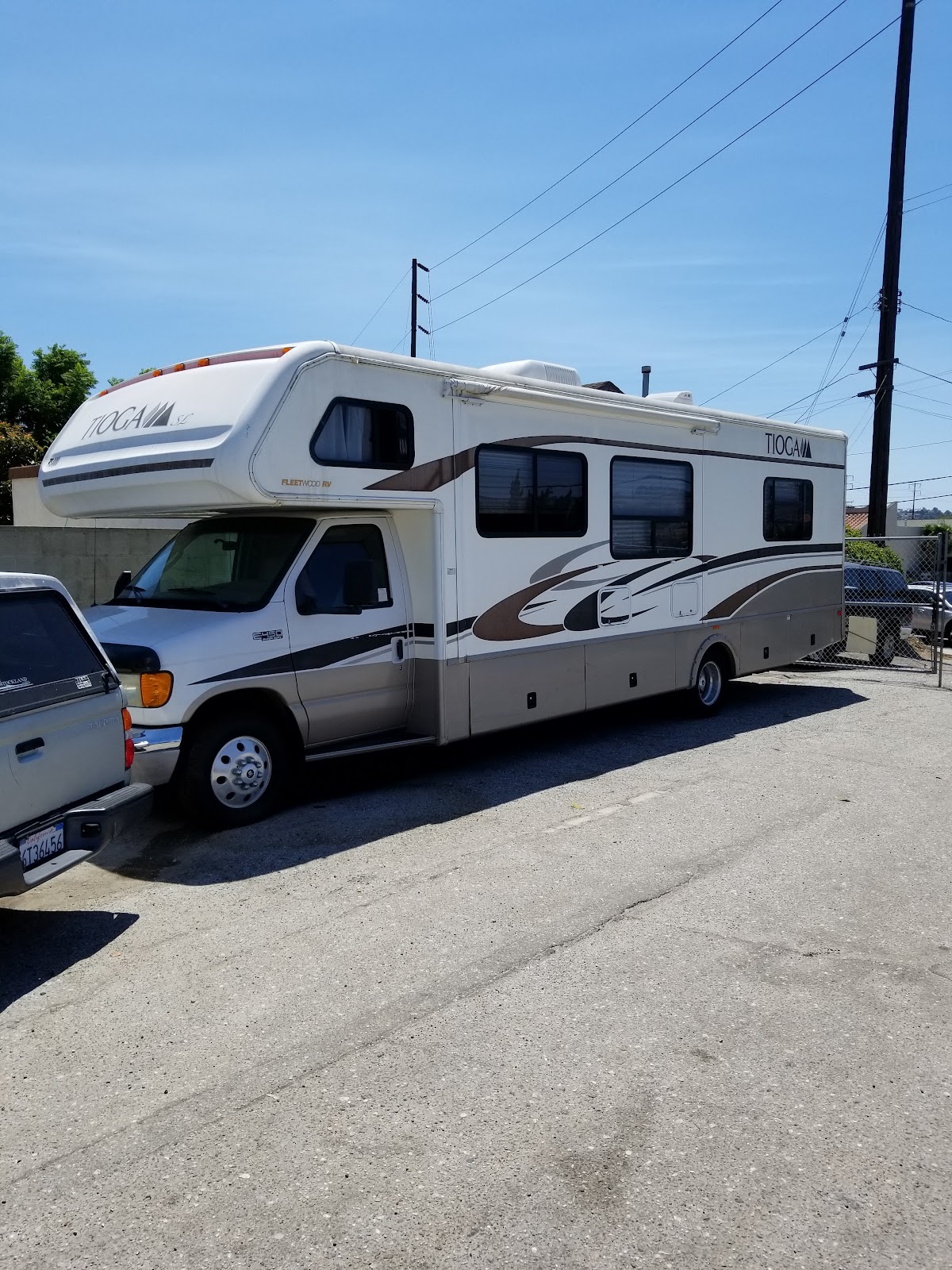 A Class C motorhome parked outside Nery's Auto Repair in Lomita